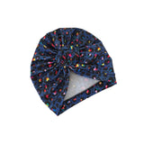 Navy blue headscarf with colorful patterns on a white background