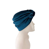 Blue headscarf on a mannequin head against a white background