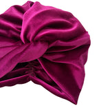 Close-up of a purple satin headscarf on a white background