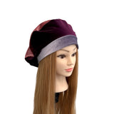 Mannequin head wearing a two-tone purple and gray hat on a white background