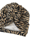 Zebra print turban with a knot on a white background