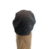 Black hair wrap on a mannequin head with blonde hair against a white background