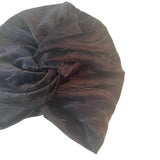 Dark brown velvet turban on a white background