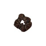 Brown leopard print scrunchie on a white background