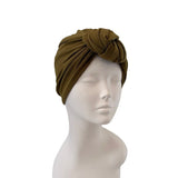 Brown headscarf on a mannequin head against a white background