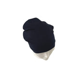 Navy blue beanie on a mannequin head against a white background