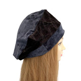 Black velvet headscarf on a mannequin head with long blonde hair against a white background ireland