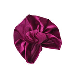 Purple satin headscarf with a knot on a white background