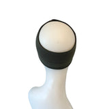 Black headband on a mannequin head with a white background