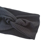 Dark gray ribbed headband with a knot on a white background