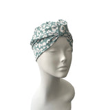 Turban with a pattern on a mannequin head against a white background