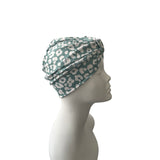 Turban with a pattern on a mannequin head against a white background