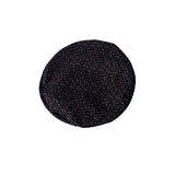 Black textured round object on a white background