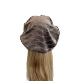 Brown satin hair bonnet on a mannequin head with blonde hair against a white background