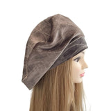 Brown velvet headscarf on a mannequin head with long hair against a white background ireland
