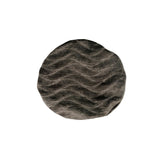 Round textured rug with wavy pattern on a white background