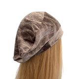 Brown velvet headband on a mannequin head with blonde hair against a white background ireland