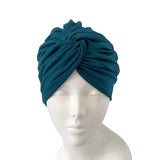 Blue headscarf on a mannequin head against a white background