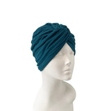 Blue headscarf on a mannequin head against a white background