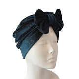 Black headband with a large bow on a mannequin head against a white background ireland