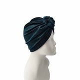 Navy blue headband on a mannequin head against a white background