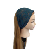 Blue lace headband on a mannequin head with long brown hair against a white background