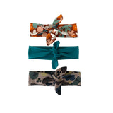 Three floral-patterned headbands on a white background