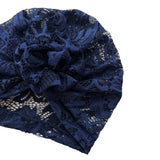 Navy blue lace headband on a white background
