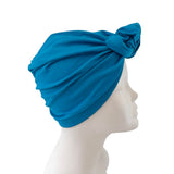 Blue headscarf on a mannequin head against a white background