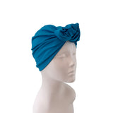 Blue headscarf on a mannequin head against a white background