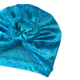 Blue velvet turban on a white background