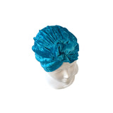 Blue textured headband on a mannequin head against a white background