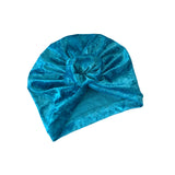 Blue velvet turban on a white background