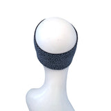 A dark gray patterned headband displayed on a white mannequin head against a plain white background.