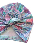 Colorful headscarf with shell pattern on a white background