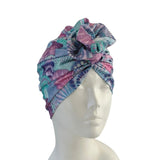 Colorful headscarf on a mannequin head against a white background ireland