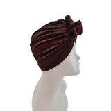 Brown headscarf on a mannequin head against a white background