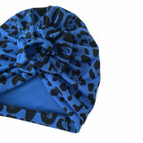 Blue headscarf with black pattern on a white background