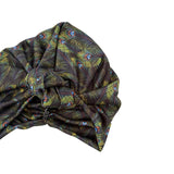 Turban with feather pattern on a white background