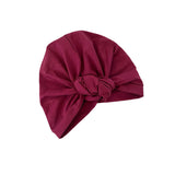 Maroon headscarf with a knot on a white background