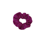 Purple scrunchie on a white background