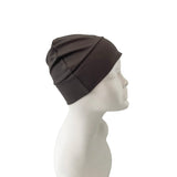 Dark gray headscarf on a mannequin head against a white background