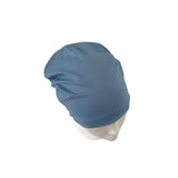 Blue headscarf on a mannequin head against a white background