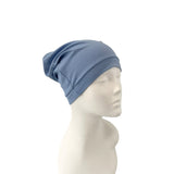 Blue headscarf on a mannequin head against a white background