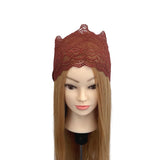 Mannequin head with a brown lace headband on a white background