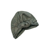Green knotted headscarf on a white background