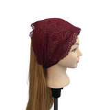 Maroon lace headband on a mannequin head with brown hair against a white background