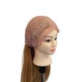Mannequin head wearing a beige lace headband on a white background