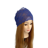 Blue lace headband on a mannequin head with long brown hair against a white background