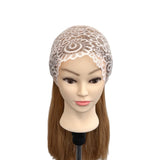 Mannequin head with a lace bonnet on a white background